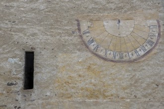 Sundial on a weathered house facade, Kaltern, South Tyrol, Italy, Europe