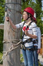 Young girl in climbing park, climbing, action, safety, belay, belay rope, belay technique, belay