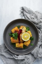 Grilled corn with spices, top view, no people, homemade