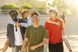 Happy group of young multiethnic friends. Friends smiling and enjoying the outdoors. Concept of