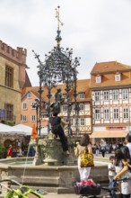 The Gänseliesel fountain is a market and ornamental fountain on the market square in front of the