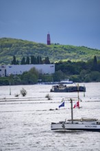 Cargo ships on the Rhine near Duisburg, in the background the Rheinpreußen spoil tip in Mörs, with