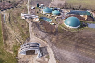 Aerial view of construction site, standard bridge and wildlife crossing bridge are build as part of