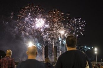 Spectators watch the fireworks at the Pyronale on the Maifeld at the Olympic Stadium, Berlin,