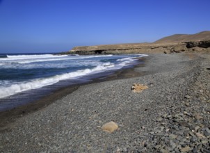 Waves breaking on beach at Playa de Garcey, Fuerteventura, Canary Islands, Spain, Europe