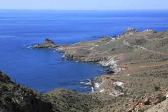 Coastal landscape Cabo de Gata natural park, looking west to the lighthouse, Almeria, Spain, Europe