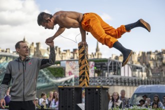 Street performers and spectators, acrobatic performance, Prince Street, world's largest cultural