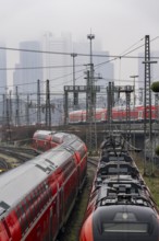 Railway tracks with regional trains, after freezing rain, in front of Frankfurt main station,