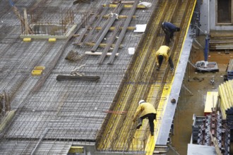 Construction site, reinforced concrete reinforcement bars, for a building ceiling, are installed