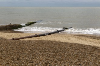 Storm drain outflow pipeline discharging into North Sea, Felixstowe, England, UK