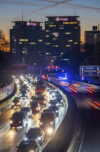 Evening traffic, partly with traffic jams, slow-moving traffic on the A40 motorway, Essen skyline,