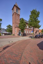 Old post office with brick tower in Varel, district of Friesland, Lower Saxony, Germany, Europe