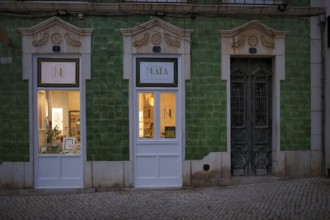 Green house with azulejos, tiles, square Praça Luís de Camões, old town, Lagos, evening mood,