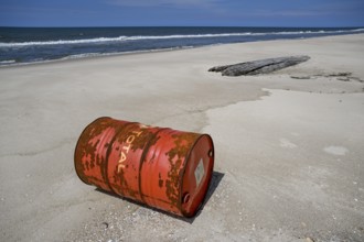 Washed up oil drum on the beach, Loango National Park, Parc National de Loango, Ogooué-Maritime