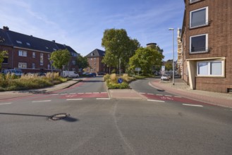 Moltkestraße with residential buildings, traffic island and city trees in Wesel, Lower Rhine, Wesel