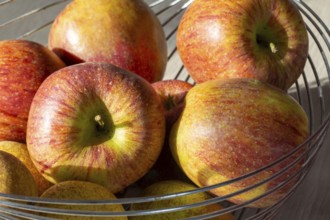 Close-up of apples and pears in the fruit basket