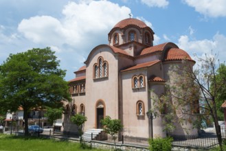 Orthodox church surrounded by red roofs and greenery, Panagia Gomatiou church, Gomati, Chalkidiki,