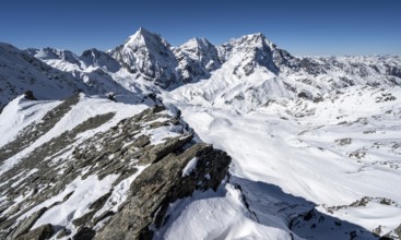 Mountain panorama with snow-covered mountain landscape in winter, view of mountain peaks