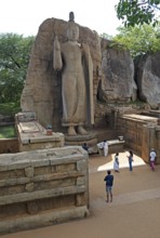 Sri Lankan pilgrims at the Avukana Buddha statue, Central Province, Sri Lanka, Asia