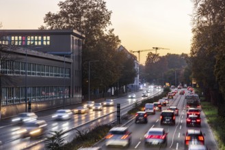 City centre street with heavy traffic in the evening. Dynamic light trails with long exposure time.