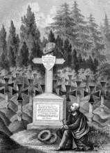 Mourning man at the tomb of Friedrich Weidig in the cemetery in Darmstadt, Germany. Friedrich