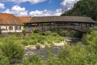 The covered wooden bridge over the river Murg in Forbach, Murg Valley, Black Forest,