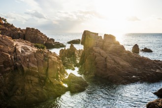 Red rocks and sea, Spiaggia Su Sirboni, sunrise, near Tertenia, Province of Ogliastra, Sardinia,