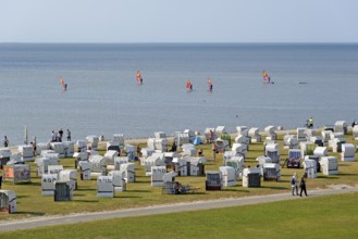 View of the beach promenade with bathing beach, kite surfers on the North Sea, Norddeich, Lower