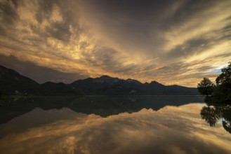 Stormy atmosphere, mountains reflected in lake, Lake Kochel, Alpine foothills, Bavaria, Germany,