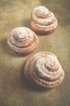 Bakery product, lemon twist, with white glaze, sweet bun, muffin, pastries, top view, no people