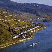 Elevated view of the Rhine and Lorch from Bacharach with barge and helicopter, Upper Middle Rhine