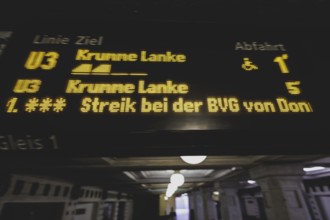 The announcement of a BVG strike is displayed on a display board at Rüdesheimer Platz underground