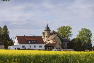 Blooming fields near Karsdorf in the Eastern Ore Mountains. Former manor in Kleincarsdorf,