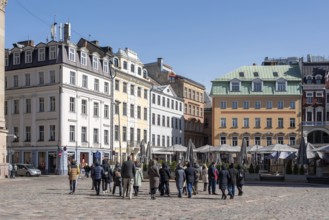 Tourists walk across the cathedral square in the Latvian capital Riga, Latvia, Europe