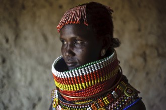 Portrait of a woman from the Turkana tribe, Kenya. She is adorned with traditional beadwork