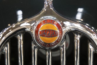 Radiator grille with logo of the Jaguar XK 140. Techno Classica is the trade fair for vintage,