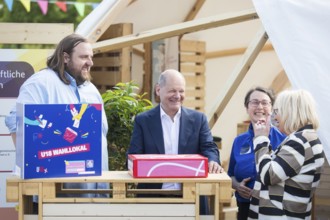 Olaf Scholz (Federal Chancellor, SPD) visits the stand of civil society organisations during a tour