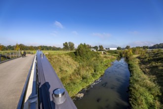 Bridge over the renaturalised Emscher in Emscherland, a new nature and water adventure park at the