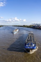 Cargo ship, tanker and river cruise ship on the Rhine, near Krefeld-Ürdingen, North