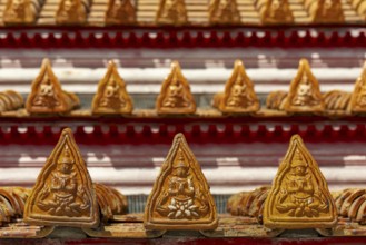 Roof decoration on the Uposatha Hall, Ubosot, the roof is staggered in three tiers and covered with