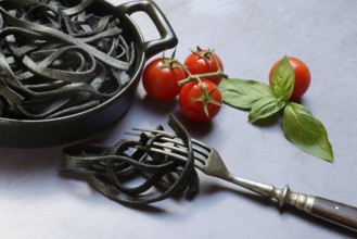 Black pasta coloured with squid ink in shell, Taglioni al Nero di Seppia, Italy, Europe