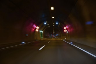 Motorway tunnel A71 with illuminated road and modern light installations offering a perspective