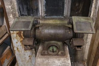 Old grinding machine in a former LPG workshop in the GDR, Mecklenburg-Vorpommern, Germany, Europe