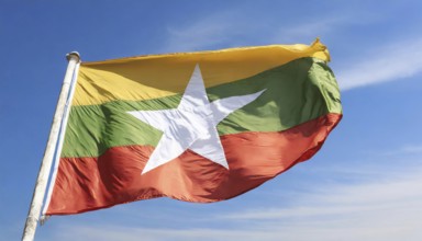 Flags, the national flag of Myanmar flutters in the wind