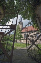 View through the garden gate to the Gothic St Mary's Church, Kalbensteinberg, Middle Franconia,