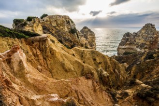 Rocky coast and red rocks, Praia do Camilo, Lagos, Algarve, Portugal, Europe