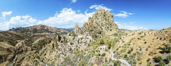 Panorama of Mountains and Olive groves around Ghost Town from a drone, Pentedattilo Village,