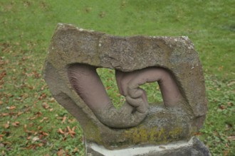 Two hands by Joachim Mennicken 2002, modern art, sandstone, looped, folded, bent, inside, into each