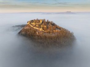 Aerial view of the Hegau volcano Hohentwiel with the upper fortress ruins illuminated by the rising