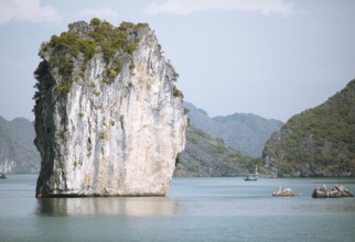 Fishing boat and the karst rocks in Lan Ha Bay, Halong Bay, Vietnam, Asia